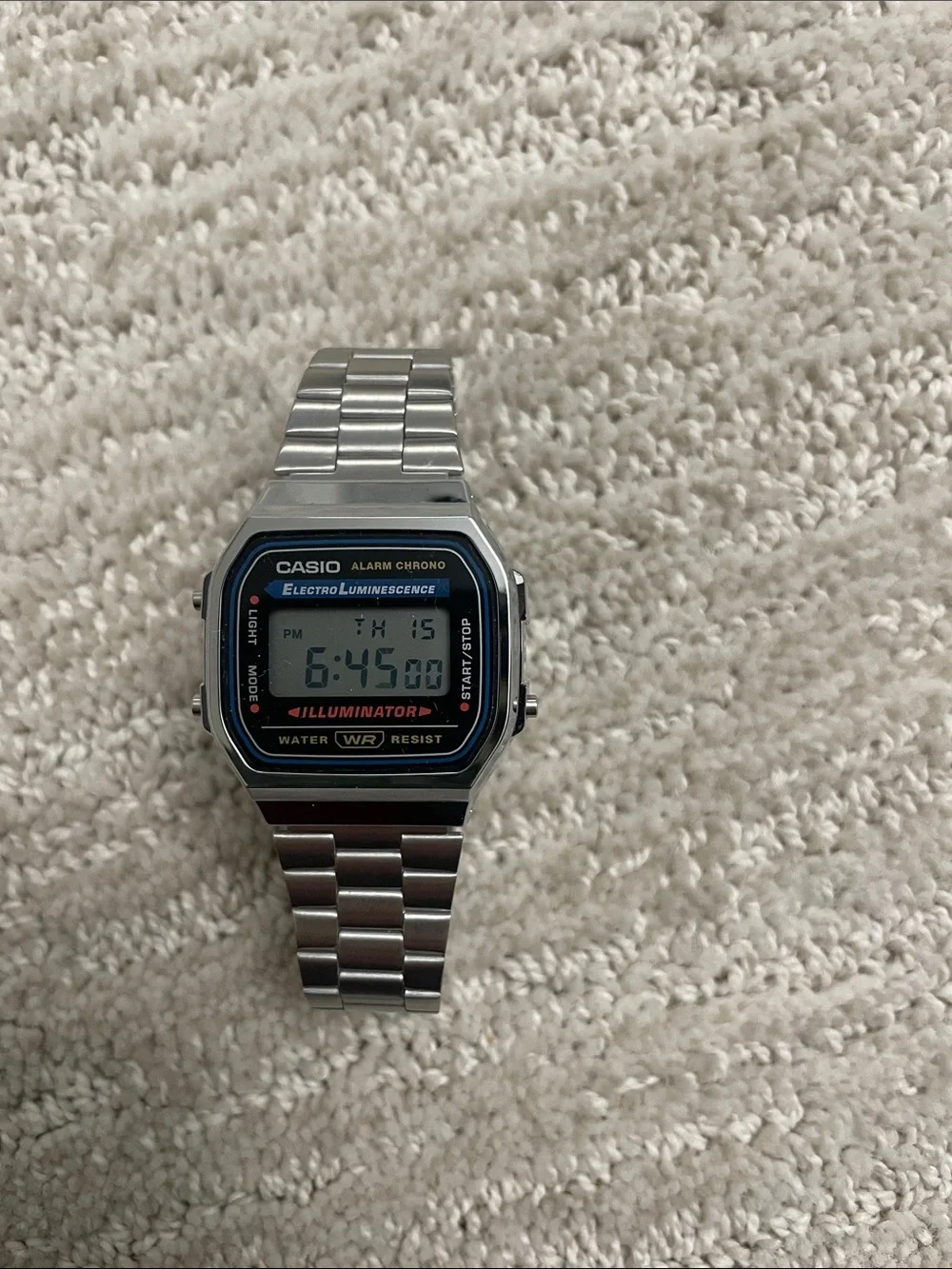 Casio Silver Digital Watch with Black and Blue Accents